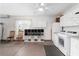 Bright garage features a ceiling fan, storage cabinets, and a convenient laundry area with washer and dryer at 8670 Se 141St Pl, Summerfield, FL 34491