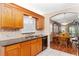 Well-appointed kitchen with sleek appliances and access to dining area and living room at 8670 Se 141St Pl, Summerfield, FL 34491