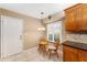 Cozy kitchen nook featuring shuttered windows and a small table with chairs at 8670 Se 141St Pl, Summerfield, FL 34491