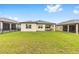 Spacious backyard with a well-maintained lawn, perfect for outdoor activities and relaxation at 8989 Sw 57Th Place Rd, Ocala, FL 34481
