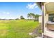 Spacious backyard with a golf course view, providing a private and picturesque setting for outdoor enjoyment at 8989 Sw 57Th Place Rd, Ocala, FL 34481
