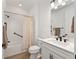 Bright bathroom featuring shower-tub, vanity with storage, and modern fixtures at 8989 Sw 57Th Place Rd, Ocala, FL 34481