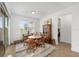 Dining area with wood table and chairs, sliding glass door, and view of the yard at 8989 Sw 57Th Place Rd, Ocala, FL 34481