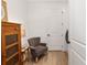 This charming laundry room also has space for a sitting area, with a chair and vintage cabinet at 8989 Sw 57Th Place Rd, Ocala, FL 34481