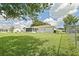 Charming home featuring a screened-in lanai and well-maintained yard, perfect for comfortable outdoor living at 9486 Se 173Rd Pl, Summerfield, FL 34491