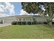 Charming single-story home with well-maintained lawn, mature tree, and inviting curb appeal at 9486 Se 173Rd Pl, Summerfield, FL 34491