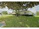 Charming single-story home with well-maintained lawn, mature tree offering ample shade at 9486 Se 173Rd Pl, Summerfield, FL 34491