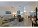 Bright and open living room with hardwood floors and comfortable seating area at 9486 Se 173Rd Pl, Summerfield, FL 34491
