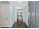 Inviting foyer featuring dark wood floors and calming light blue wall paint at 9805 Sw 95Th Loop, Ocala, FL 34481