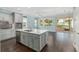 Bright kitchen features stainless appliances, a center island, and elegant light-gray cabinetry at 9805 Sw 95Th Loop, Ocala, FL 34481