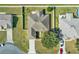 Aerial view of the home showcasing the roof line, landscaping, and driveway at 9952 Sw 58Th Ave, Ocala, FL 34476