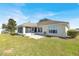 Spacious backyard with screened porch and a concrete patio area at 9952 Sw 58Th Ave, Ocala, FL 34476