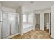 Bright bathroom with separate shower, tub, tile floor, and water closet at 9952 Sw 58Th Ave, Ocala, FL 34476