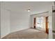 Bedroom featuring carpet, a window with curtains, neutral walls and a ceiling light at 9952 Sw 58Th Ave, Ocala, FL 34476