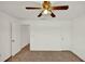 Simple bedroom with a ceiling fan and neutral walls and carpet at 9952 Sw 58Th Ave, Ocala, FL 34476