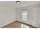 Neutral-walled bedroom with window and carpet flooring at 9952 Sw 58Th Ave, Ocala, FL 34476