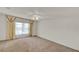 Spacious bedroom featuring neutral walls, carpet flooring, and a ceiling fan at 9952 Sw 58Th Ave, Ocala, FL 34476