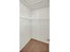 Walk-in closet featuring neutral walls and white shelving at 9952 Sw 58Th Ave, Ocala, FL 34476