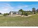 Beautiful entrance to the community with landscaping and a stone sign at 9952 Sw 58Th Ave, Ocala, FL 34476