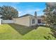 Back exterior view of house featuring a chimney, and large backyard at 9952 Sw 58Th Ave, Ocala, FL 34476