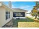 Exterior view of home featuring screened porch and spacious backyard at 9952 Sw 58Th Ave, Ocala, FL 34476
