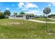 A home exterior featuring a well-manicured lawn and inviting front porch at 10210 Sw 93Rd Ave, Ocala, FL 34481