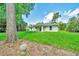 View of rear exterior elevation and backyard at 10675 Sw 69Th Ter, Ocala, FL 34476