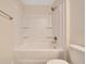 Bright bathroom featuring a tub-shower combination and neutral wall color at 10675 Sw 69Th Ter, Ocala, FL 34476
