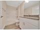 Bathroom featuring a shower and bathtub combination and a granite countertop at 10675 Sw 69Th Ter, Ocala, FL 34476