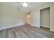 Light filled bedroom features modern ceiling fan and a sliding door closet at 10675 Sw 69Th Ter, Ocala, FL 34476