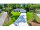 Charming single-story home featuring a well-manicured lawn, long driveway, and a two car garage at 10675 Sw 69Th Ter, Ocala, FL 34476