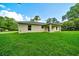 A charming single-story home with a minimalist design, and a lush green lawn at 10675 Sw 69Th Ter, Ocala, FL 34476