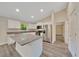 Open concept kitchen with stainless steel appliances, granite countertops, and a large island at 10675 Sw 69Th Ter, Ocala, FL 34476