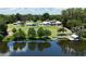 Expansive lakefront property featuring a main house, guest house, private dock and lush landscaping at 10893 Se 141 Avenue Rd, Ocklawaha, FL 32179