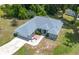 A scenic aerial view of a home that features an attached garage and clean landscaping at 11645 Mallard Ct, Dunnellon, FL 34432