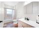 Bright bathroom featuring vanity, mirror, and shower-tub combo at 11645 Mallard Ct, Dunnellon, FL 34432