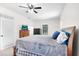 Cozy primary bedroom featuring carpet flooring, ceiling fan, and natural light at 11645 Mallard Ct, Dunnellon, FL 34432