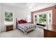 Bedroom with carpet flooring, ceiling fan, and windows with natural light at 11645 Mallard Ct, Dunnellon, FL 34432