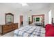 Spacious bedroom featuring a large window, a ceiling fan and plenty of natural light at 11645 Mallard Ct, Dunnellon, FL 34432
