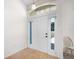 Bright entryway featuring a white front door with sidelights and transom windows above, plus neutral tile flooring at 11645 Mallard Ct, Dunnellon, FL 34432