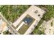 Aerial view of modern home on a large lot, featuring a long driveway and surrounding trees at 12251 Sw 67Th Ln, Ocala, FL 34481
