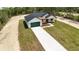 Aerial view of a new construction home with large lot and white driveway at 12251 Sw 67Th Ln, Ocala, FL 34481