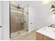 Modern bathroom featuring a glass shower, sleek fixtures, and a tiled accent wall at 12251 Sw 67Th Ln, Ocala, FL 34481