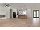 Spacious living room showcases an open floor plan with modern lighting and an island at 12251 Sw 67Th Ln, Ocala, FL 34481