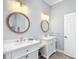 Charming bathroom featuring double vanities, marble countertop and decor at 15620 Nw 112Th Ave, Reddick, FL 32686