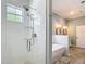 Elegant bathroom with a seamless glass shower and a freestanding tub at 15620 Nw 112Th Ave, Reddick, FL 32686