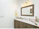 Bathroom features a wood vanity, modern mirror, and designer accents at 15620 Nw 112Th Ave, Reddick, FL 32686
