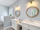 Charming bathroom featuring double vanities, marble countertop and decor at 15620 Nw 112Th Ave, Reddick, FL 32686