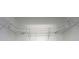 Walk in closet with metal rack shelving and white walls at 15620 Nw 112Th Ave, Reddick, FL 32686