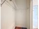Walk in closet with metal rack shelving and view to renovated bathroom at 15620 Nw 112Th Ave, Reddick, FL 32686